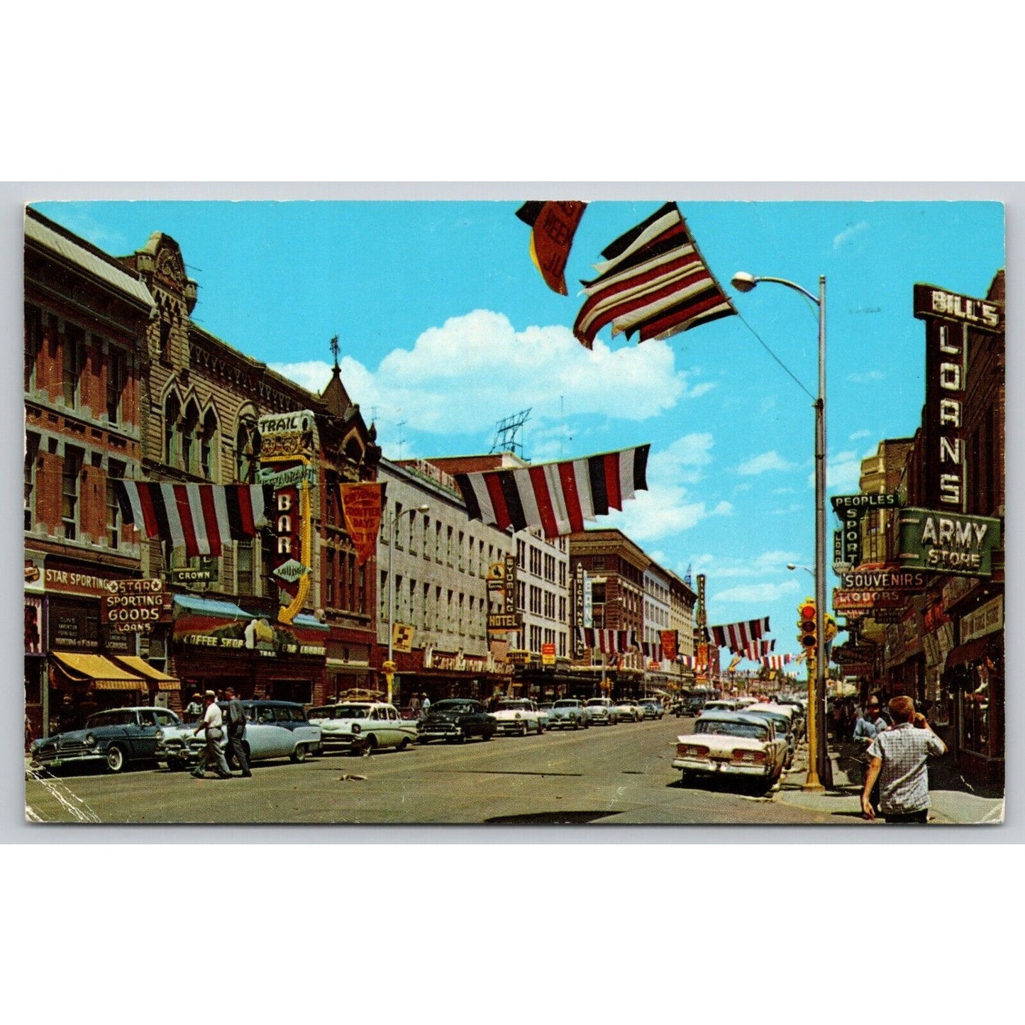 Postcard WY Cheyenne Sixteenth Street Scene Flags Hotel Lorns Army Store B7